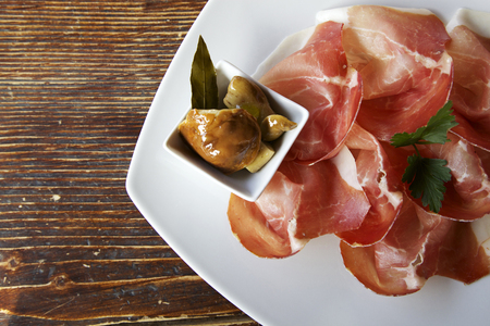 seasoned culatello with porcini mashroom の写真素材