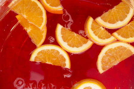 a closeup of a bown of spritz cocktail and slices of fresh orange