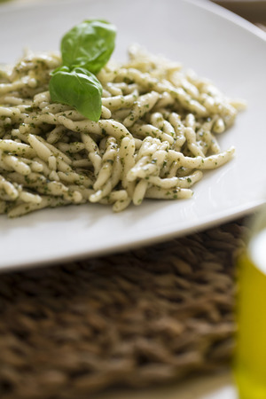 closeup of trofie al pesto on a tableの写真素材