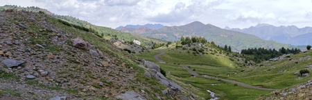 The mountains and the massif along the green path to the Piedrafita de Jaca lake in the aragonese Pyrenees mountainsの写真素材