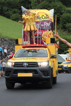 Soulan, France - July 25, 2018: The McCain Foods cars throwing free gifts during the Tour de France 17th stage in Soulanのeditorial素材