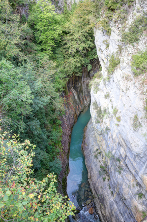The waterfalls and the rapids in the Rio Bellos canyon on the forest covered rocky mountains in the Canon de Anisclo valley, in Aragon region, Spainの写真素材