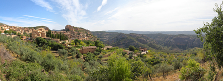A landscape, during a sunny summer, of Alquezar, a small medieval rural town with a castle monastery and a canyon in the Vero river, in Aragon, Spainの写真素材