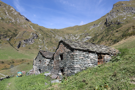 The Walser town of Pianmisura, with wood and stone lodges, high mountains, forests and pastures, in summer, in Val d'Otro valley, Alps mountains,Italyのeditorial素材