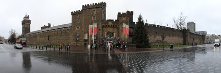 Cardiff, United Kingdom - December 01, 2018: A wide angle view of the entrance door and walls of the medieval Cardiff Castle after rain in a cloudy winter day in Cardiff, Wales, United Kingdomのeditorial素材