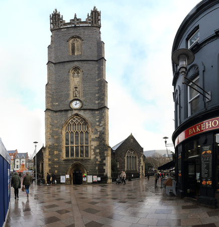 Cardiff, United Kingdom - December 01, 2018: The 15th century Saint John The Baptist Church and bell tower in a cloudy winter day after rain in Cardiff, United Kingdomのeditorial素材