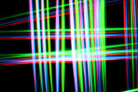 A colorful and glowing light painting abstract image with red, green, blue and yellow blurry lines...