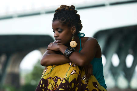 African American woman sits and thinksの写真素材