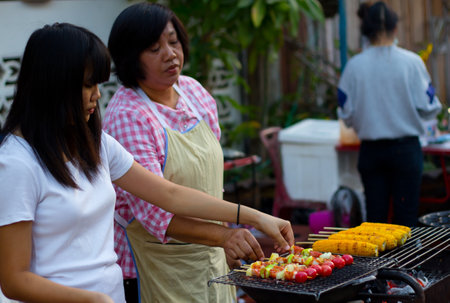 CHIANG KHAN, THAILAND - Jan 1, 2015 : BBQ and corn grilled selling at the walking street in Chiang Khanのeditorial素材