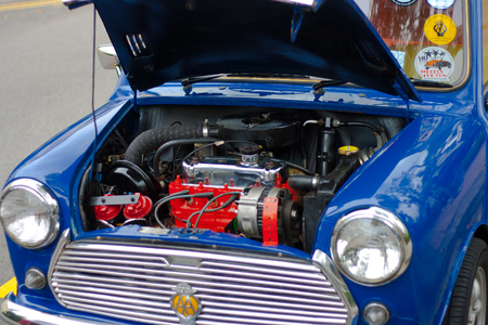 Raffles Landing Site, Singapore - July 27, 2008 : Vintage Mini Cooper hood open showing engine in...