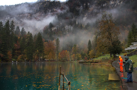 Tourists fishing for trout at Blausee lake, Switzerlandのeditorial素材