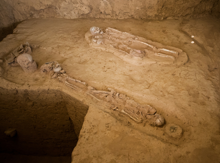 Ban Kao neolithic burial site in Kanchanaburi, Thailand displays skeletons pots and axesの写真素材