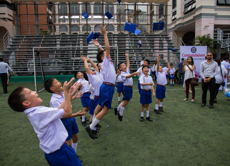 Bangkok, Thailand - July 27, 2017 :Asian students toss their certificate in the air at St. Gabriel's Collegeのeditorial素材