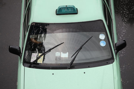 Bedok, Singapore - Oct 23,2010 : Windscreen wipers cleaning windshield glass on rainy day on Bedok road Singaporeのeditorial素材