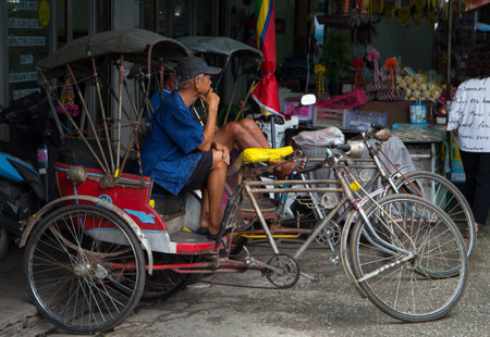 Lamphun, Thailand - October 27, 2017: Rickshaw parking in front of market waiting for customer