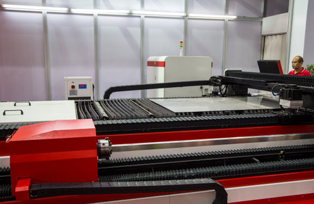 Bangkok, Thailand - November 22, 2017: Worker operate Laser Cutting Machine in Metalex 2017のeditorial素材