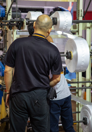 Worker maintenance extruder machine of polyethylene for industry process of plastic bagのeditorial素材