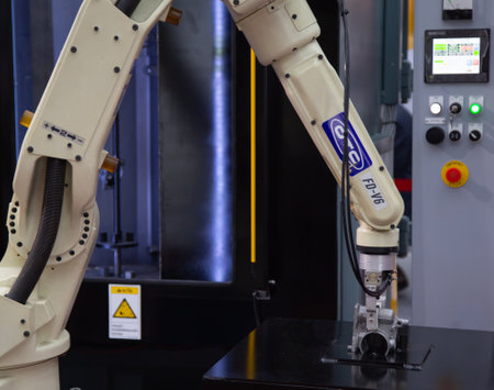 Bangkok, Thailand - June 20, 2018: Robot arm perform loading / unloading object display in Manufacturing Expo 2018のeditorial素材