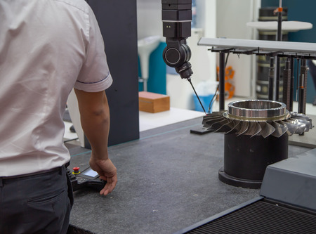 Worker control CMM Coordinate Measuring Robotic Machine measuring turbineの写真素材