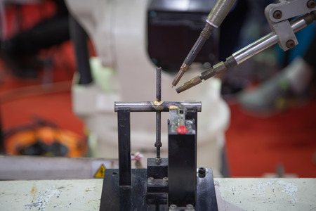 Robotic arm TIG welding machine welding steel workpiece