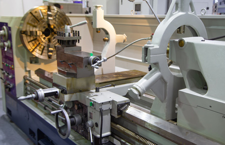 Close-up of manual lathe machine, industrial metalwork manufacturing