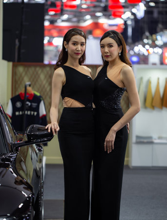 Nonthaburi, Thailand - December 4, 2018: Presenters pose with car in Motor Expo 2018のeditorial素材
