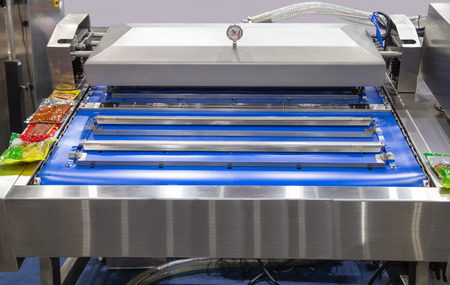 Automatic heat sealing vacuum packaging machine for food packagingの写真素材