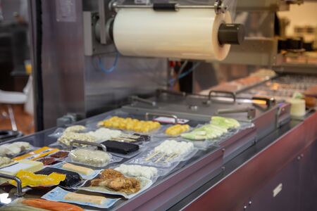 Linear tray food heat sealing and packaging machineの写真素材