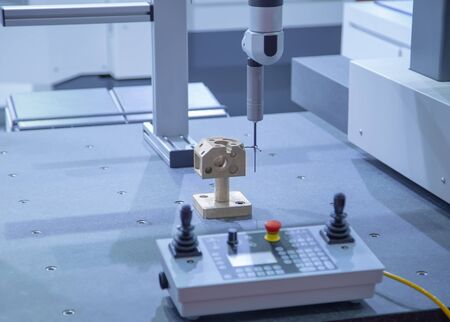 Measuring automotive part on the Coordinate Measuring Machine (CMM)の写真素材