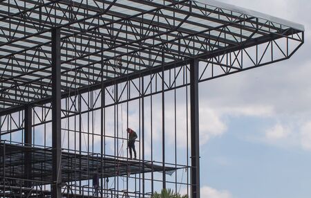 Construction worker working on structural building