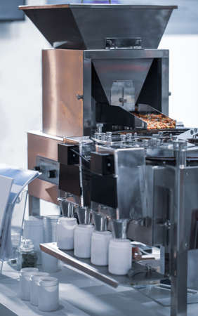 Capsule drug counting and filling machine. Pharmaceutical industry