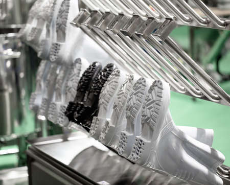 White rubber boots footwear in manufacturing warehouse
