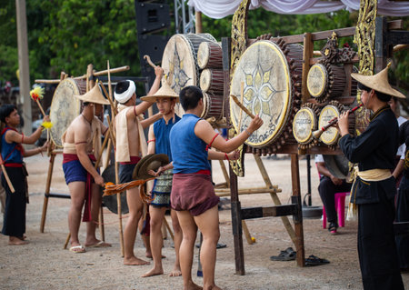 Lamphun, Thailand - April 12, 2019: Artists wear ancient Lanna costume perform Lanna drum music on Songkran festival in Lamphun provinceのeditorial素材