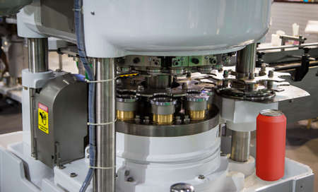 High speed can seamer machine. Tin can sealing machinery. Food industry.