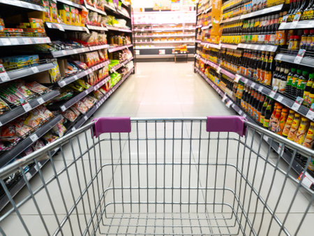 Bangkok Thailand - April 1 2022: Shopping cart and view of merchandise on shelve in Max Valu supermarket.のeditorial素材