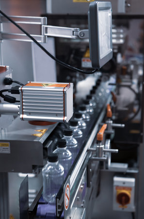 Liquid filling and bottle capping machine. Water bottling plant.
