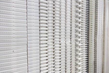 Plastic belt conveyor for food industry production line.