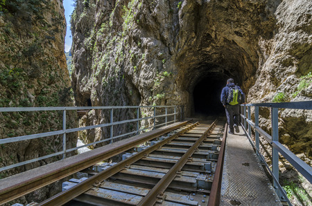 Hiking man in the Vouraikos gorge. DiakoftoKalavryta gauge rack railway. Peloponnese - Greeceのeditorial素材