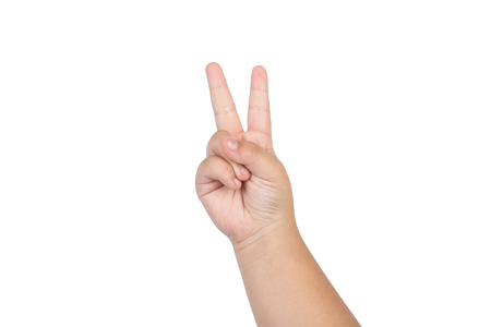 Children Hand with two fingers up isolated on white backgroundの写真素材