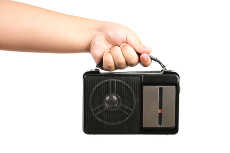 hand children hold old AM FM radio isolated on white backgroundの写真素材