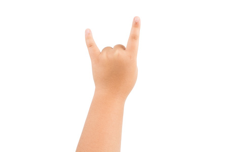 Children hand show sign rock and roll, devil horn gesture isolated on white backgroundの写真素材