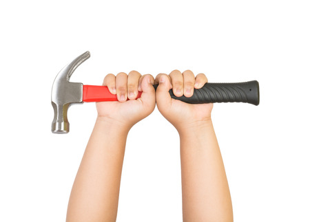Child's hand holding a hammer isolated on white backgroundの写真素材