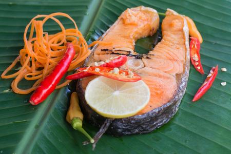 Thai style food Grilled Salmon on banana leafの写真素材