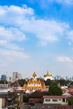 Bangkok cityscape with golden pagoda and blue sky, Thailand