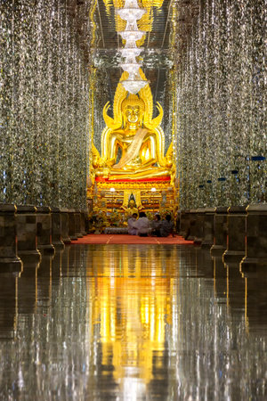 Beautiful of golden buddha statue in crystal temple at Wat Chantaram  (Wat Tha Sung) in Uthai Thani, Thailandの写真素材