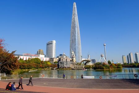 Seoul, South Korea - October 30, 2017: Seoul sky and Lotte World amusement park around Seokchon lake with clear blue sky, a major tourist attraction and korean people must exercise and relax  in Seoul, South Korea.のeditorial素材