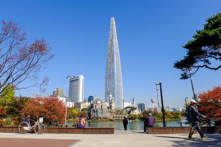 Seoul, South Korea - October 30, 2017: Seoul sky and Lotte World amusement park around Seokchon lake with clear blue sky in autumn, a major tourist attraction and korean people must exercise and relax in Seoul, South Korea.のeditorial素材