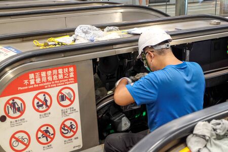Taipei, Taiwan - July 20, 2018 : Taiwan professional mechanical repair and maintenance change part of escalator at C.K.S.Memorial Hall  Station in Taipei, Taiwanのeditorial素材