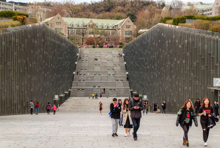 Seoul South, Korea - April 10 ,2019:Students walking through Ewha Womans University main library building at evening time - very prestigious school in Seoul, South Korea.のeditorial素材