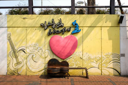 Daegu, South Korea - April 5 2019 : Tourist visit at Kim Kwang Seok Memorial Street. It is a street to commemorate the singer Kim Kwang Seok.のeditorial素材
